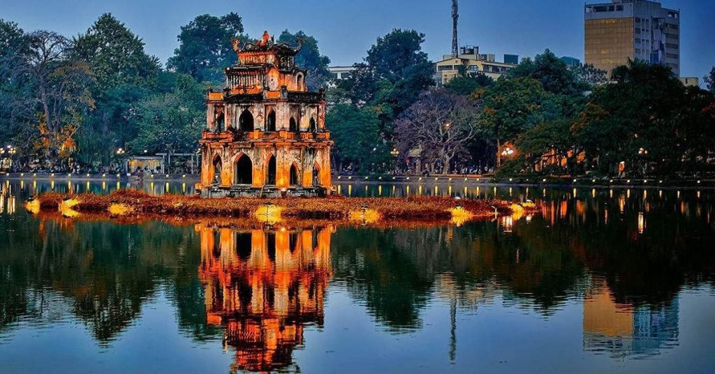 View of Hoan Kiem Lake with The Huc Bridge leading to Ngoc Son Temple in Hanoi