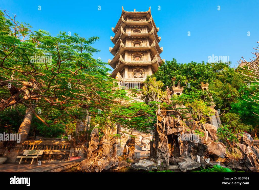 Panoramic view of Marble Mountains in Da Nang with stairs, pagodas, and greenery