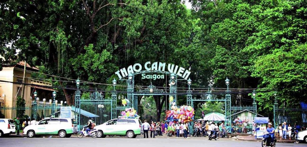 Saigon Zoo entrance gate with visitors and colonial-style architecture