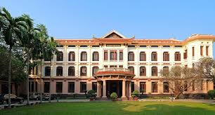 Vietnam Fine Arts Museum facade with yellow colonial architecture and traditional red tiles