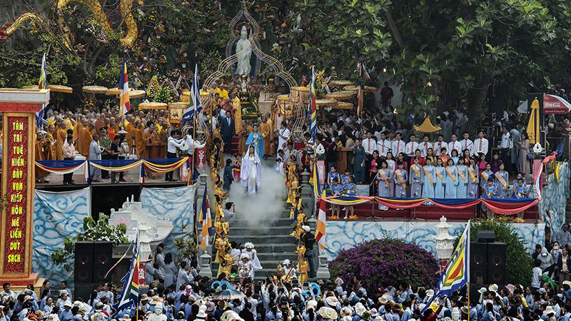 Monks and locals gathering during the Quan The Am Festival at Marble Mountains, Da Nang