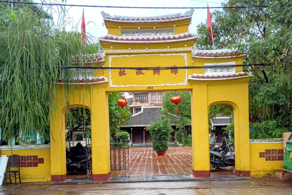 Front view of Hai Chau Communal House in Danang with traditional roof and stone pillars