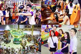 Children playing games and families at Helio Center Danang