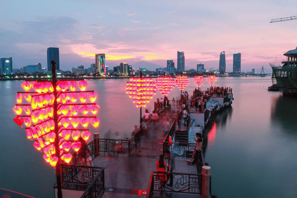Love Bridge Danang with heart-shaped lanterns glowing at night