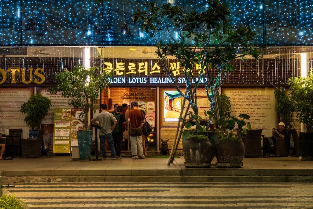 Korean Street District 7 with restaurants, shops, and people walking in Ho Chi Minh City