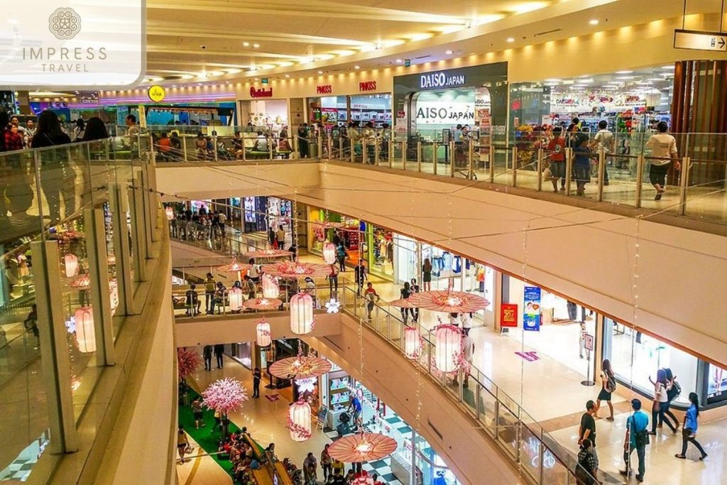 Shoppers browsing through a clothing sale at a major Vietnam mall