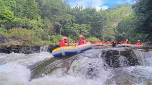 Tourists enjoying waterfall sliding at Hoa Phu Thanh, Danang