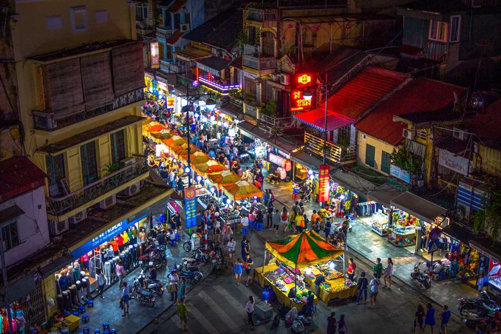 A vibrant Hanoi food market with street food vendors
