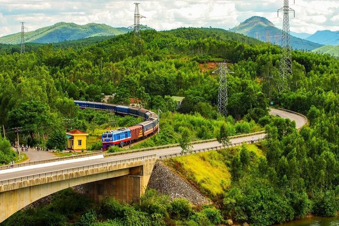 Scenic mountain train at Ba Na Hills traveling through lush greenery