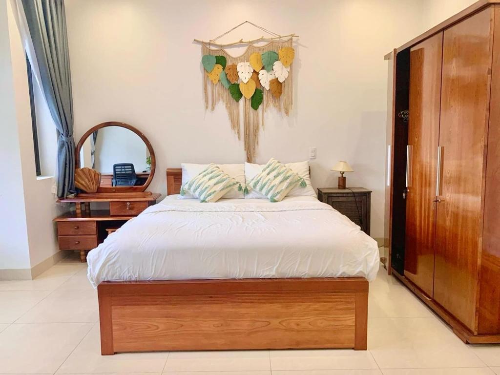 A cozy homestay room with wooden furniture and warm lighting