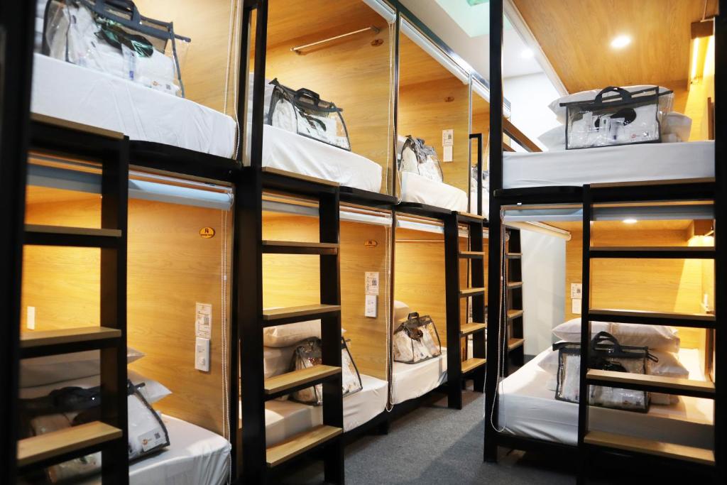 Budget-friendly hostel dorm room with bunk beds and backpacks